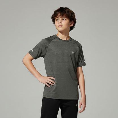 Person wearing a gray t-shirt and black pants on a plain background