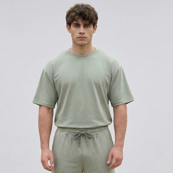 Fold Men's loose fit crew neck t-shirt in light olive green 100% polyester with a ribbed neckline.